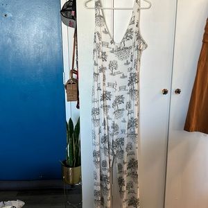 Shabby Chic jumpsuit with black illustrations on linen material.